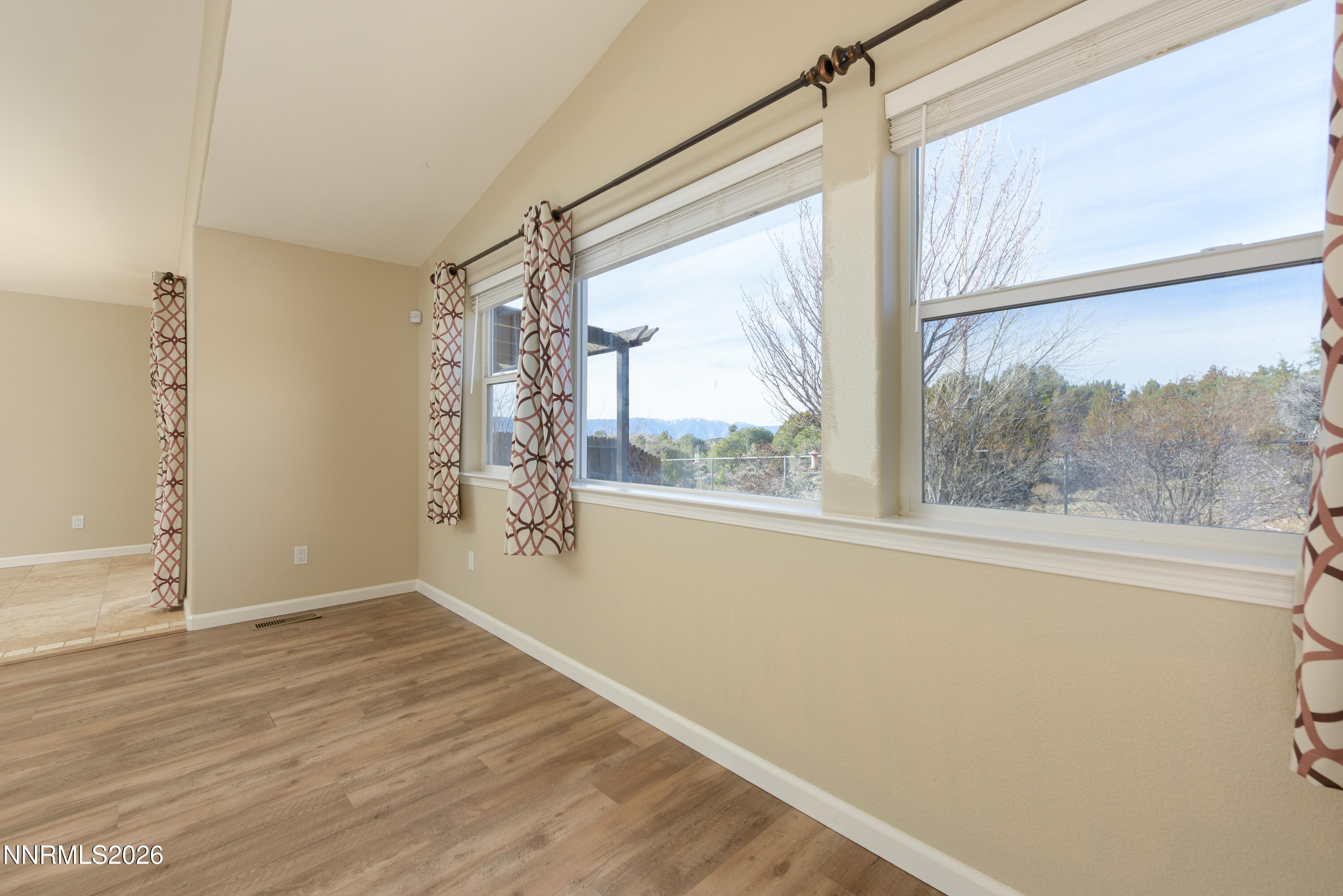 44 Conner Way Gardnerville, NV 89410 - Photo 9 of 38 a view of empty room with wooden floor and fan
