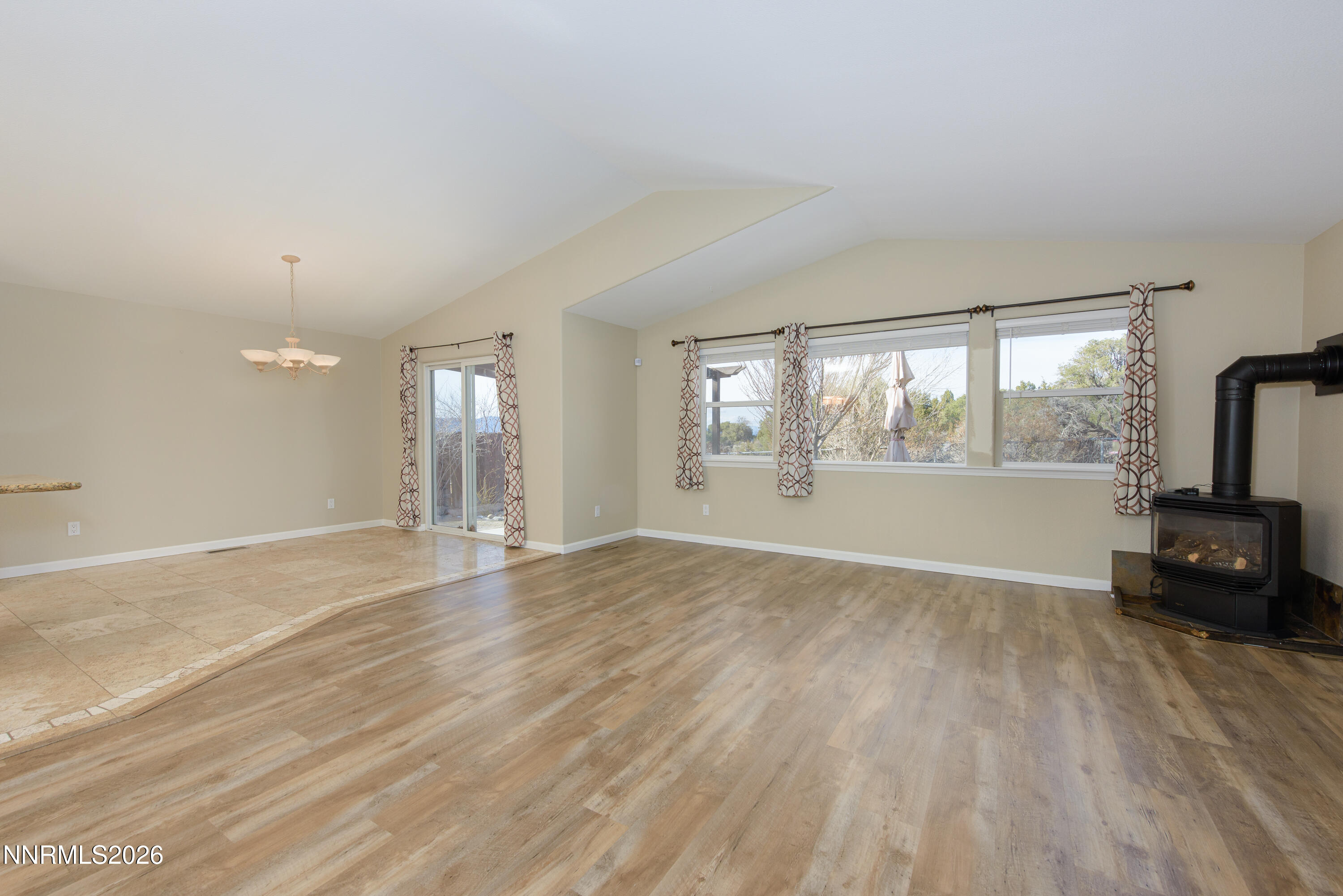 44 Conner Way Gardnerville, NV 89410 - Photo 10 of 38 wooden floor in an empty room with a window
