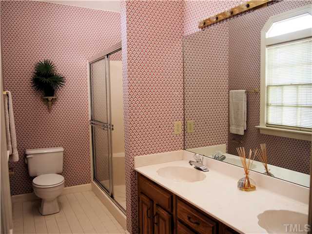 2900 Bannf Court Raleigh, NC 27604 - Photo 12 of 19 a bathroom with a sink toilet and shower