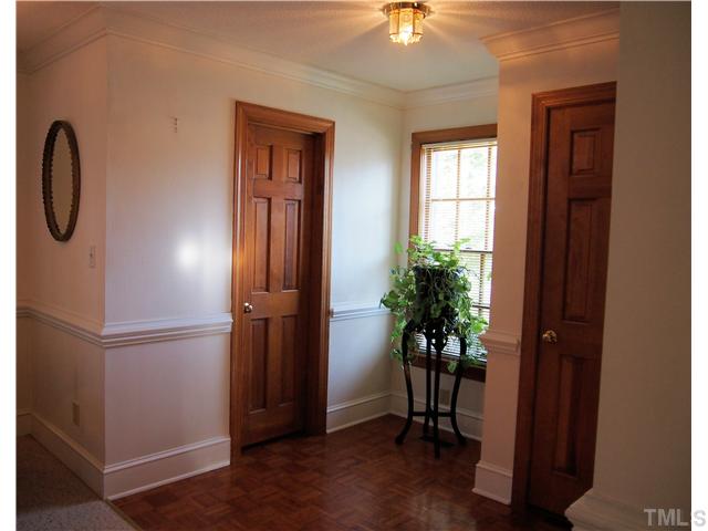 2900 Bannf Court Raleigh, NC 27604 - Photo 4 of 19 a view of a livingroom with a potted plant