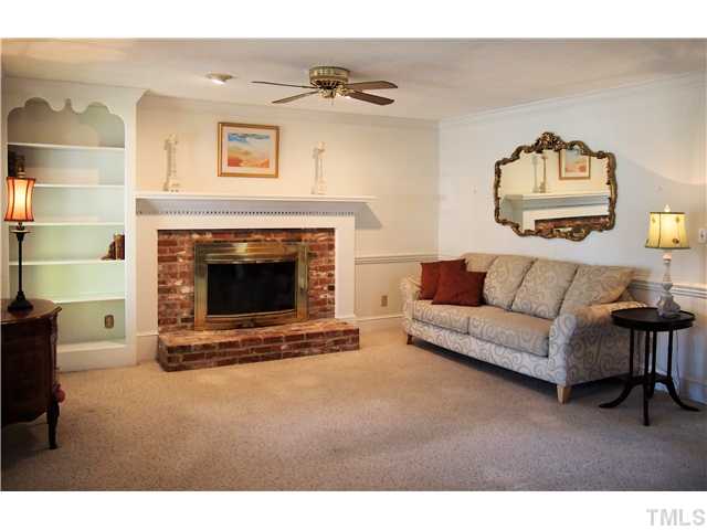 2900 Bannf Court Raleigh, NC 27604 - Photo 5 of 19 a living room with furniture and a fireplace