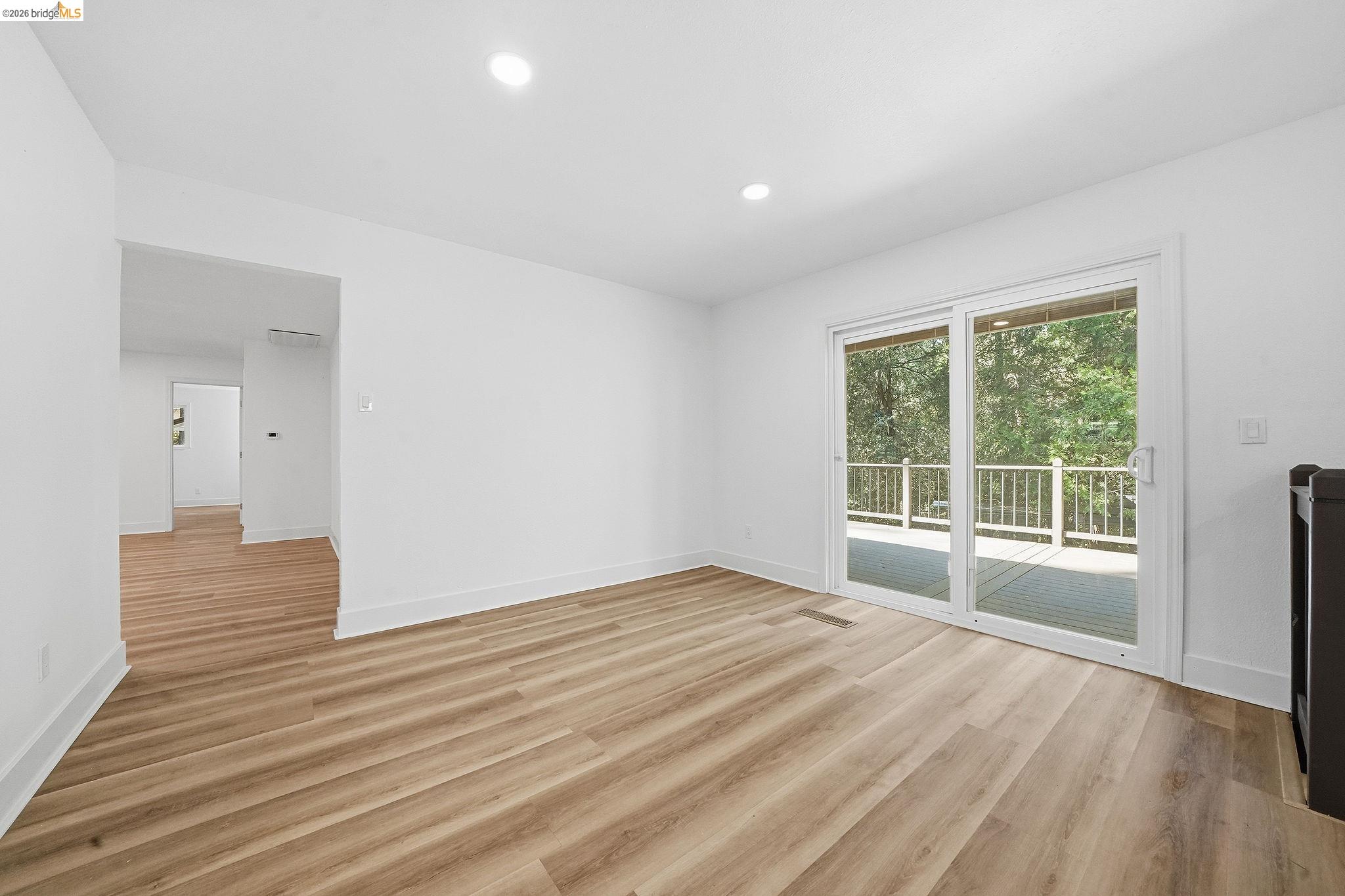 23656 Lightning Pioneer, CA 95666 - Photo 14 of 23 a view of an empty room with wooden floor and a window