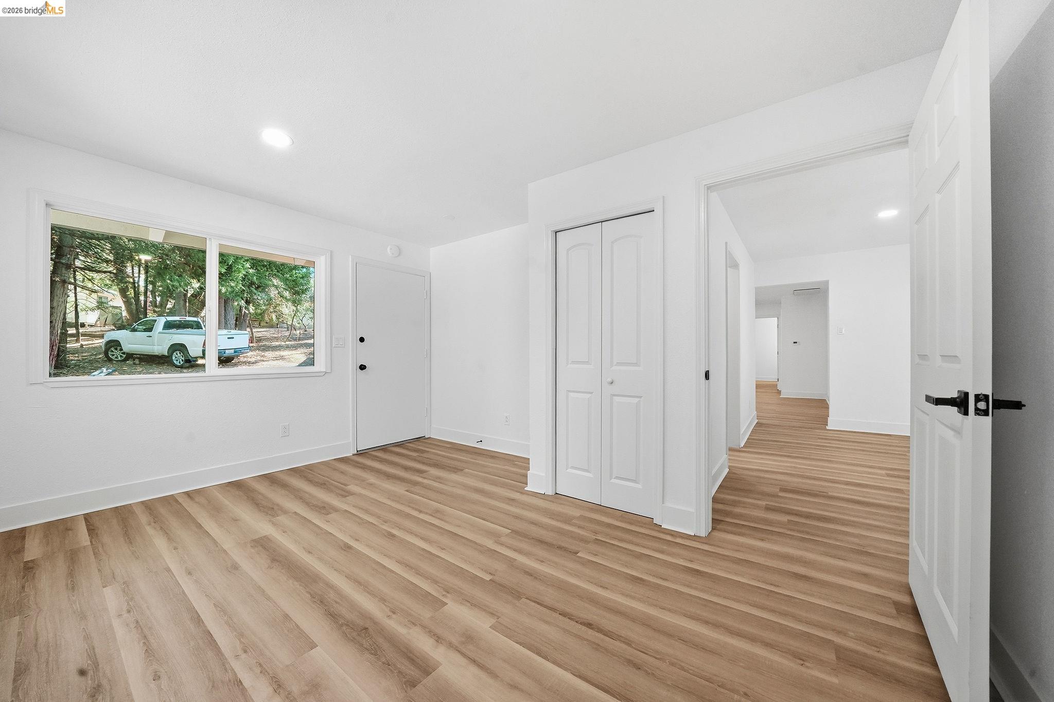 23656 Lightning Pioneer, CA 95666 - Photo 16 of 23 wooden floor in an empty room with a window