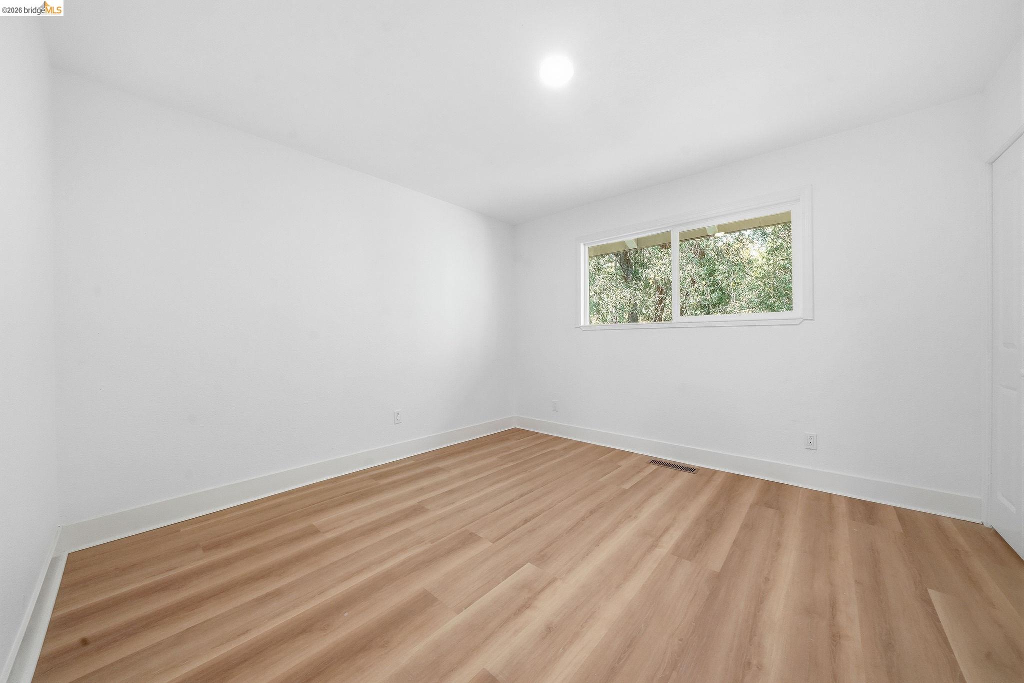 23656 Lightning Pioneer, CA 95666 - Photo 7 of 23 Empty room with light wood finished floors and baseboards
