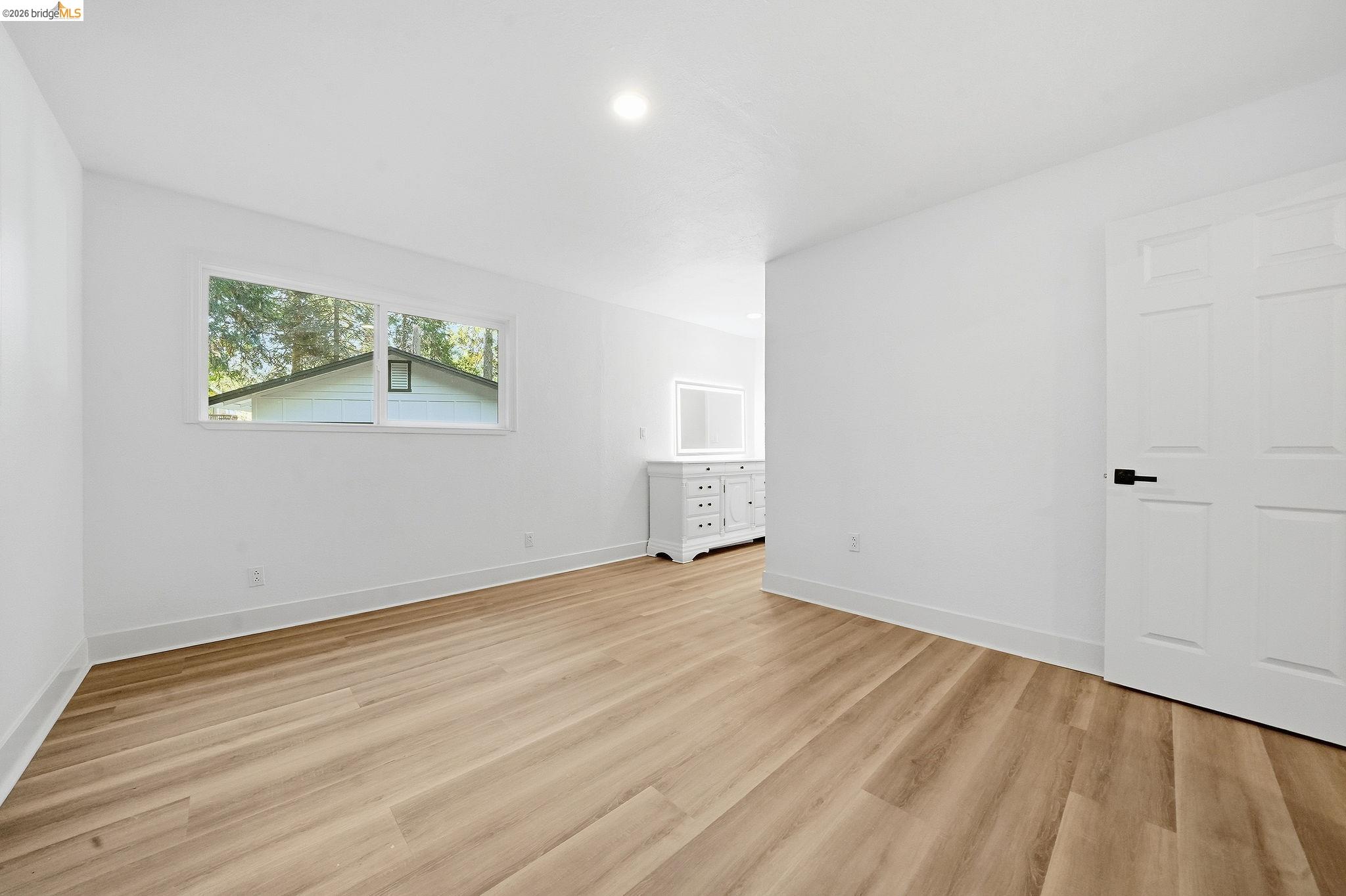 23656 Lightning Pioneer, CA 95666 - Photo 8 of 23 Unfurnished bedroom with light wood-style flooring and recessed lighting