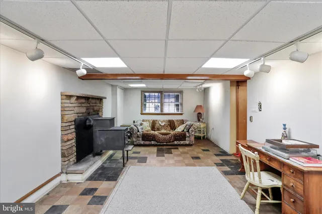 a living room with furniture a window and a table