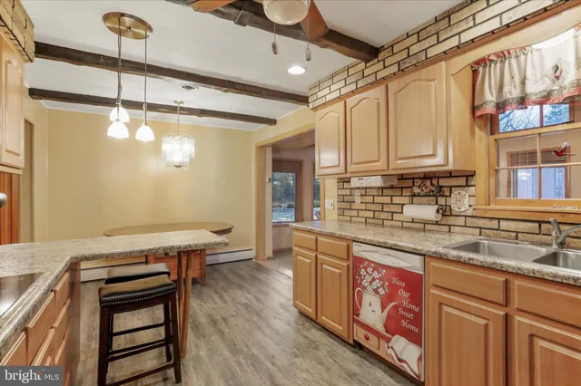 a kitchen with stainless steel appliances granite countertop a workspace