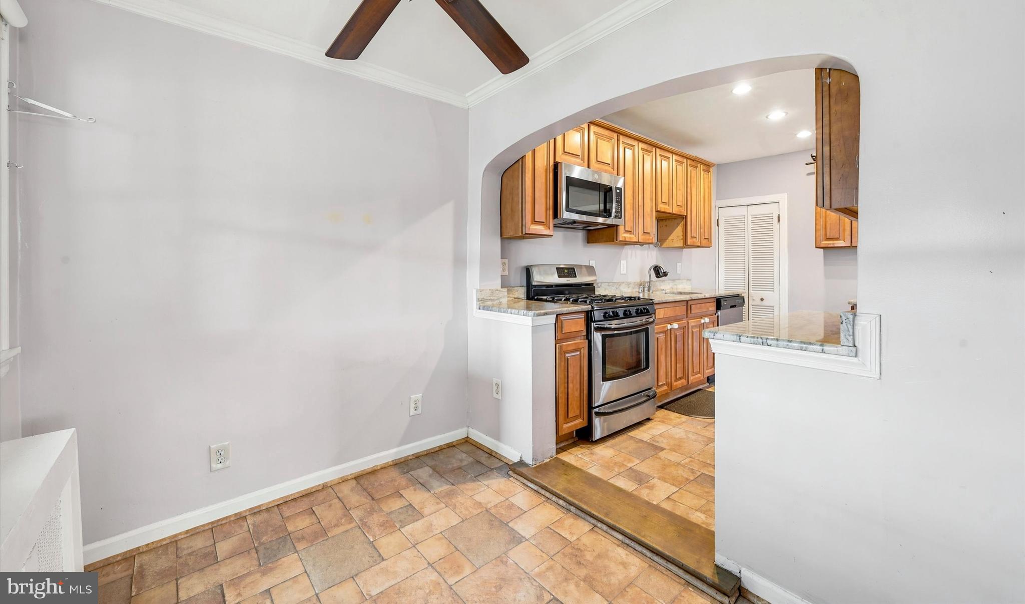 1210 Harding Drive Havertown, PA 19083 - Photo 13 of 25 a kitchen with stainless steel appliances granite countertop a stove a sink and a refrigerator