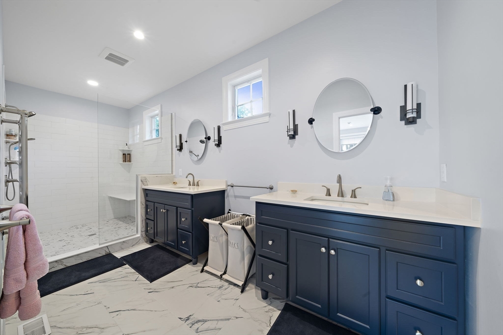 53 Border Street Scituate, MA 02066 - Photo 13 of 34 a spacious bathroom with a double vanity sink and a mirror