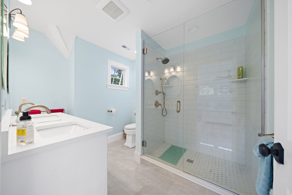 53 Border Street Scituate, MA 02066 - Photo 16 of 34 a bathroom with a sink vanity mirror and toilet