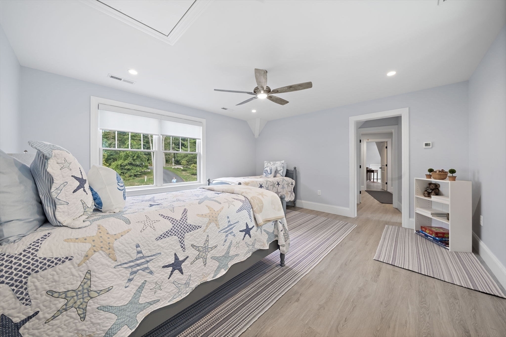 53 Border Street Scituate, MA 02066 - Photo 17 of 34 a bedroom with a large bed and a large window