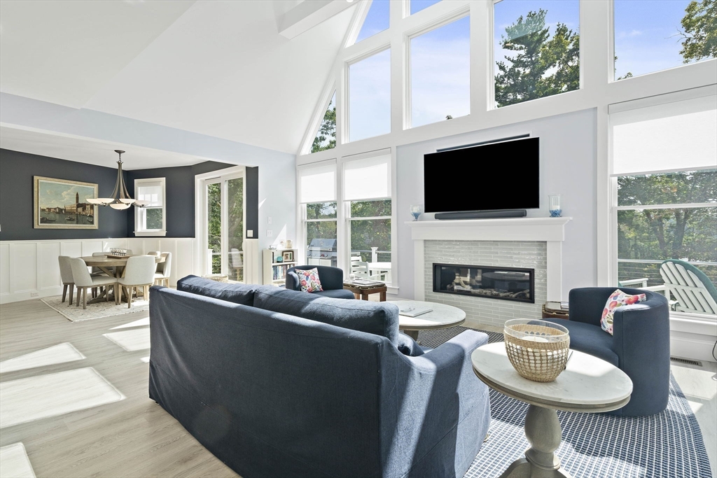 53 Border Street Scituate, MA 02066 - Photo 2 of 34 a living room with furniture a fireplace and a flat screen tv