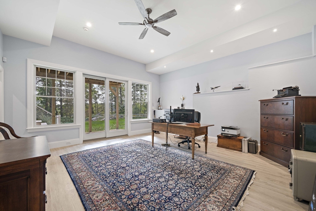 53 Border Street Scituate, MA 02066 - Photo 21 of 34 a living room with furniture and a rug