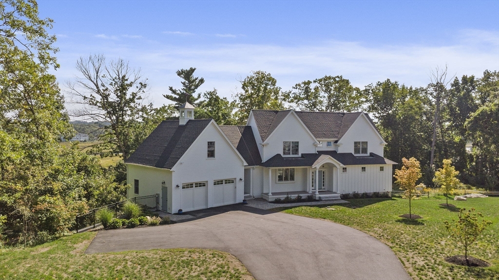 53 Border Street Scituate, MA 02066 - Photo 28 of 34 a front view of a house with a yard and trees