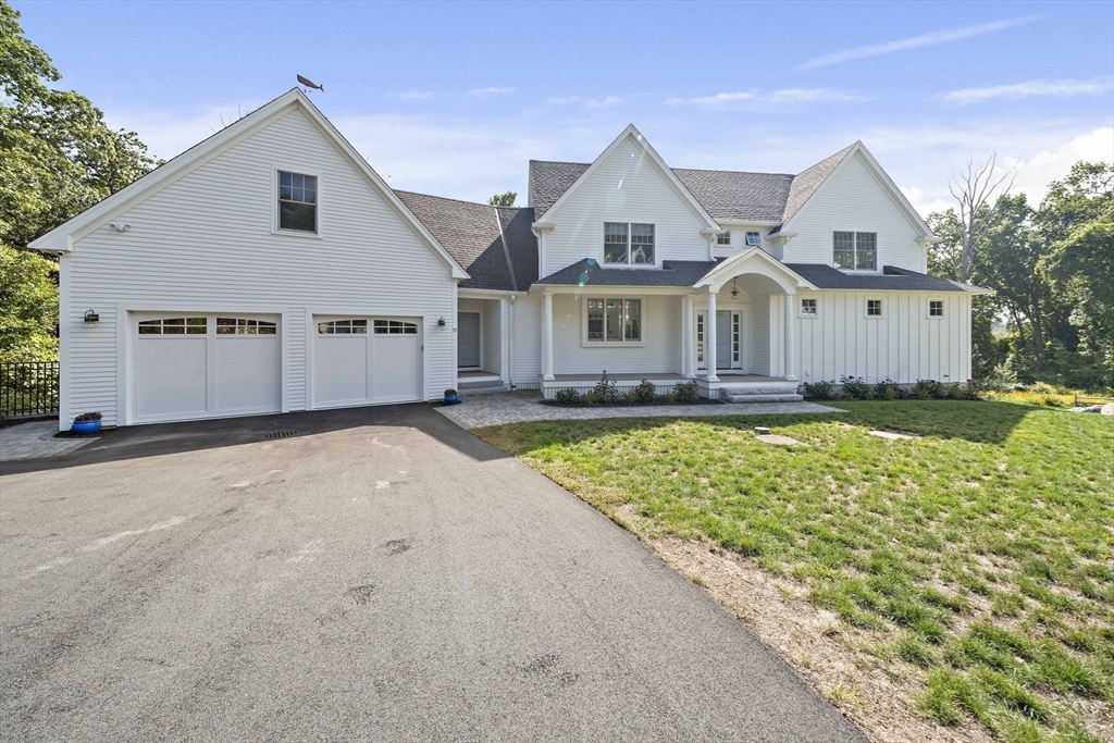 53 Border Street Scituate, MA 02066 - Photo 34 of 34 a front view of a house with a yard and trees