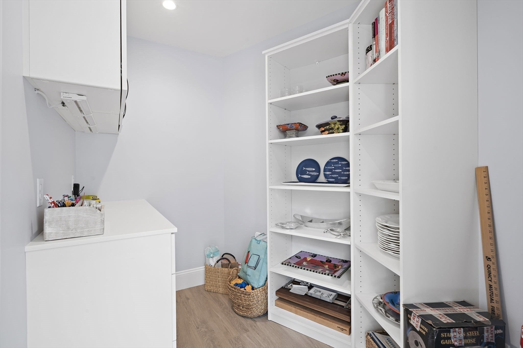 53 Border Street Scituate, MA 02066 - Photo 6 of 34 a storage room with washer and dryer