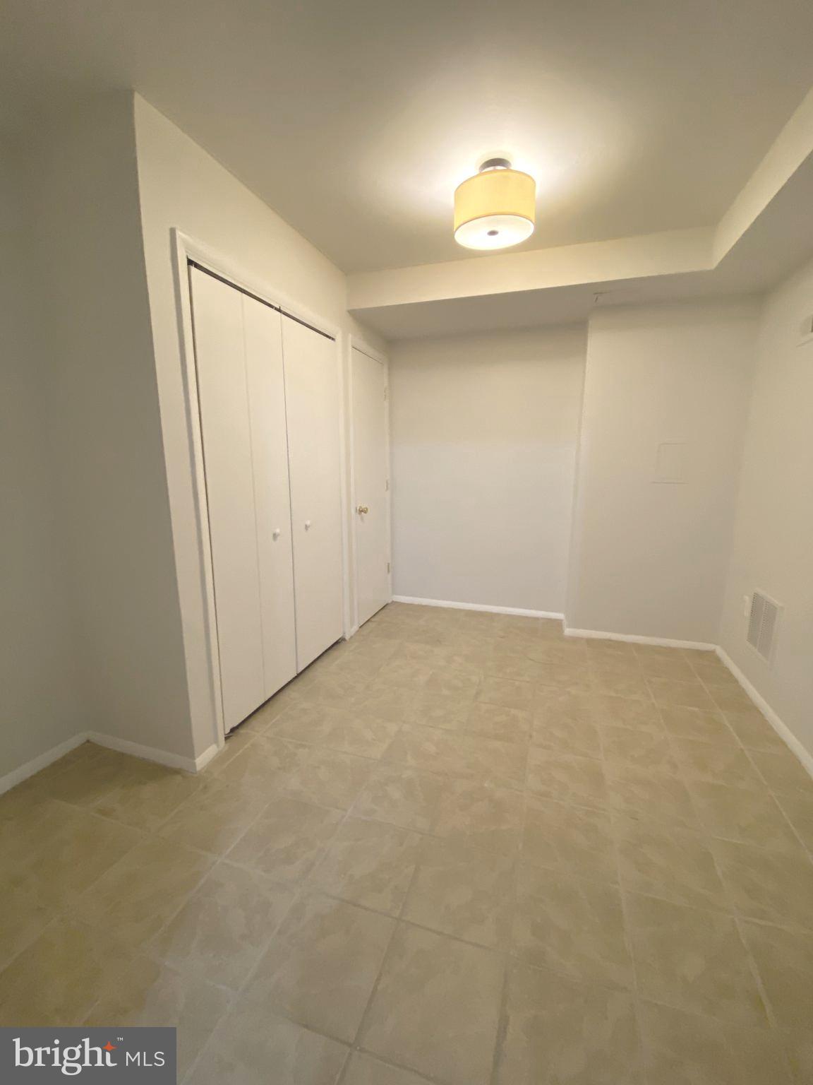 15947 Dorset Road, Unit 188 Laurel, MD 20707 - Photo 20 of 24 an empty room with a natural light