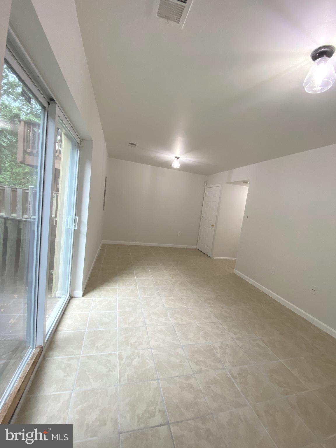 15947 Dorset Road, Unit 188 Laurel, MD 20707 - Photo 22 of 24 an empty room with windows