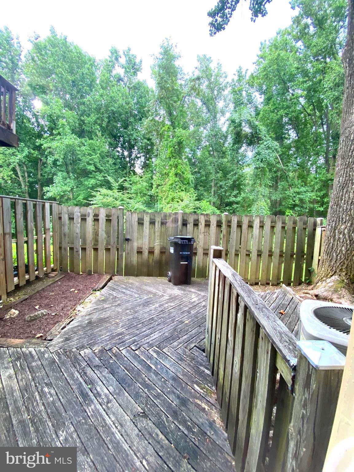 15947 Dorset Road, Unit 188 Laurel, MD 20707 - Photo 23 of 24 a view of deck and patio with wooden fence
