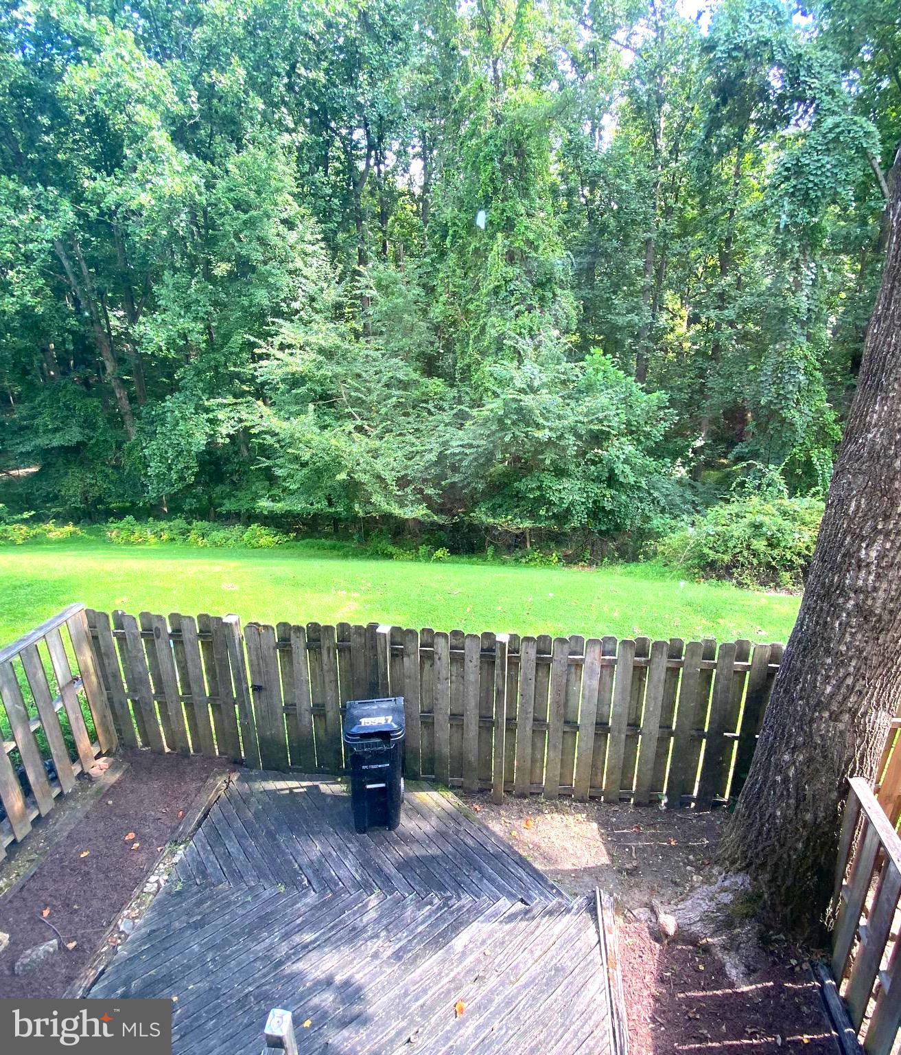 15947 Dorset Road, Unit 188 Laurel, MD 20707 - Photo 24 of 24 a view of a backyard with wooden fence and a floor