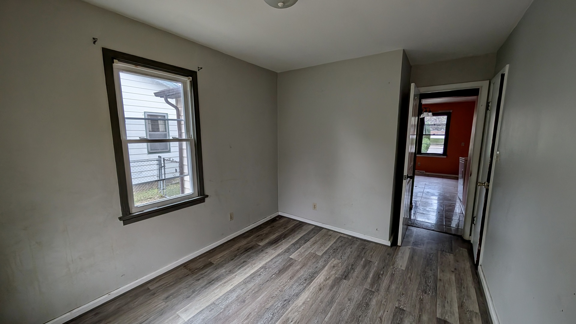 639 Wood Court Kankakee, IL 60901 - Photo 14 of 43 an empty room with wooden floor and windows