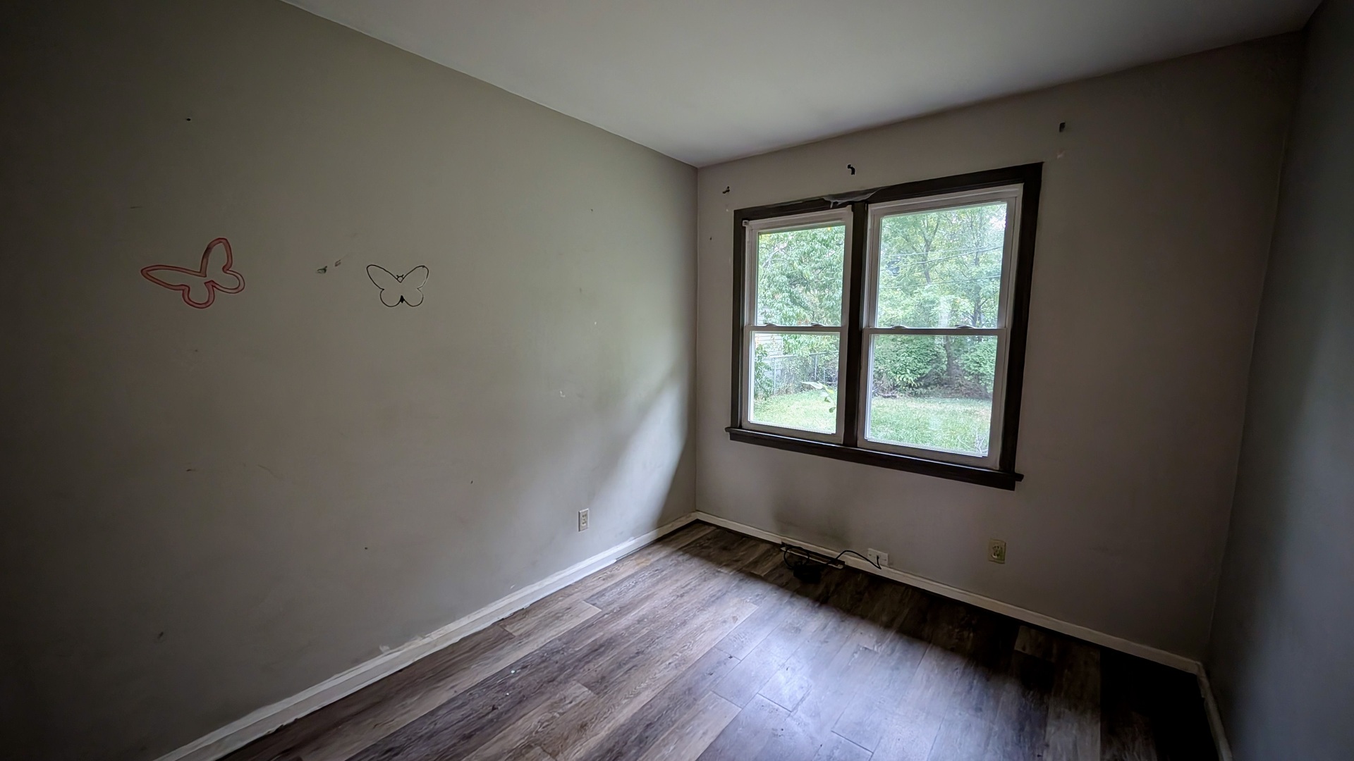 639 Wood Court Kankakee, IL 60901 - Photo 22 of 43 a view of an empty room with wooden floor and a window