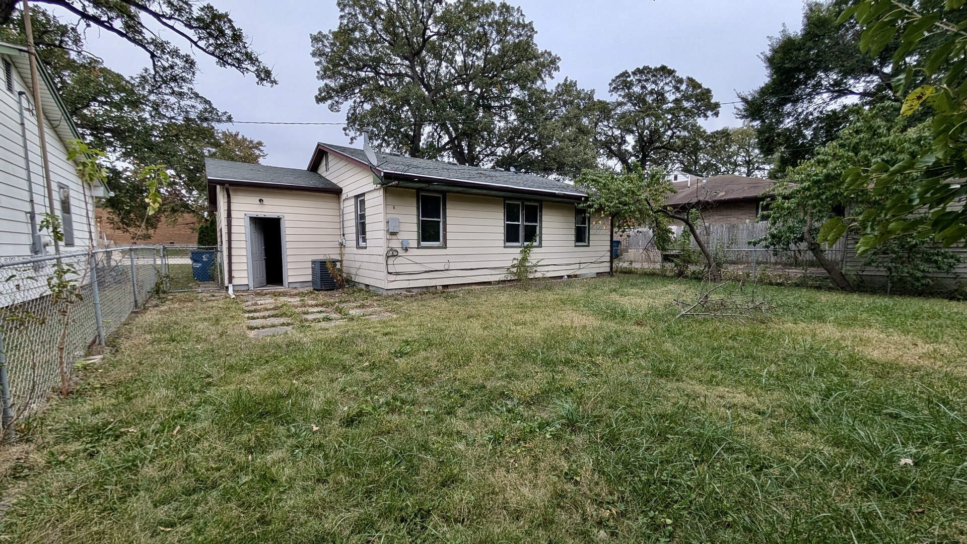 639 Wood Court Kankakee, IL 60901 - Photo 38 of 43 a white house that has a tree in front of it