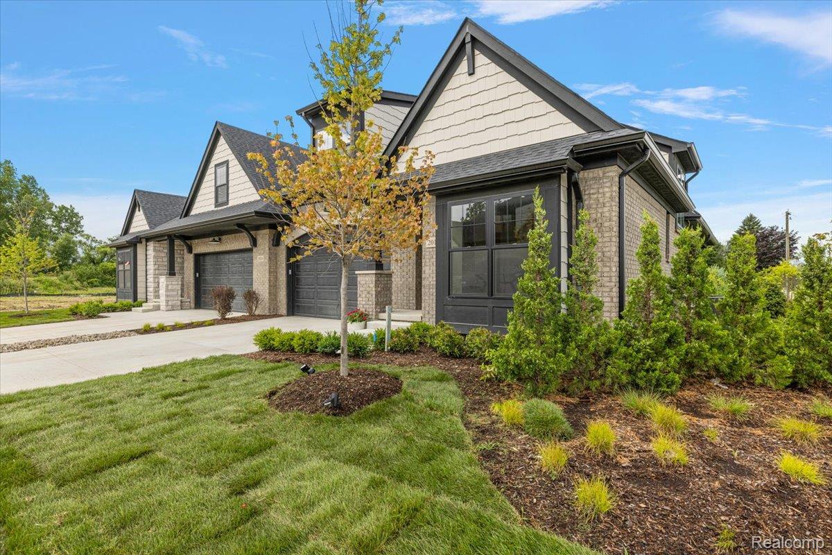 2027 Breckenridge Court, Unit 3 Rochester, MI 48309 - Photo 2 of 42 Brick exterior with dark trim and siding accents