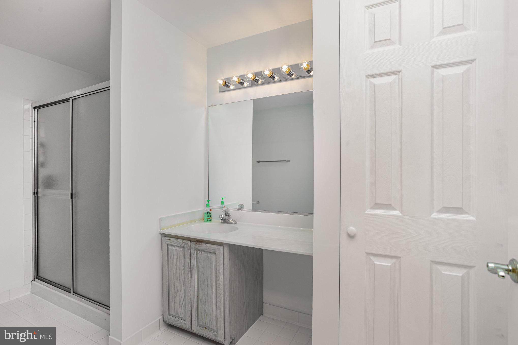 3901 Darleigh Road, Unit C Nottingham, MD 21236 - Photo 13 of 23 a bathroom with a sink vanity and a mirror