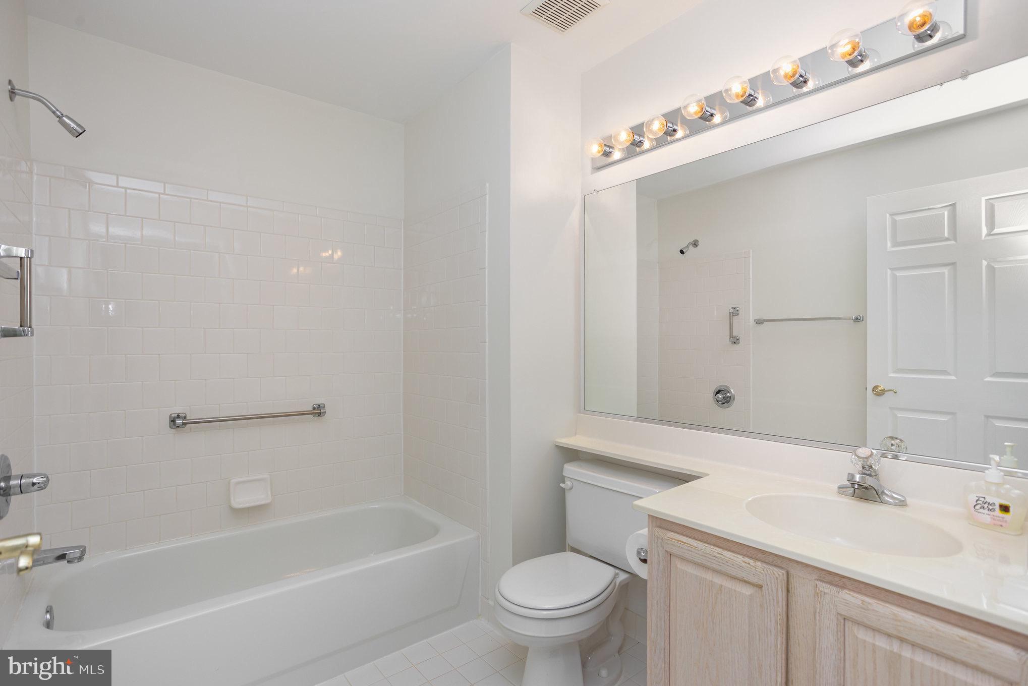 3901 Darleigh Road, Unit C Nottingham, MD 21236 - Photo 15 of 23 a bathroom with a sink a toilet and shower