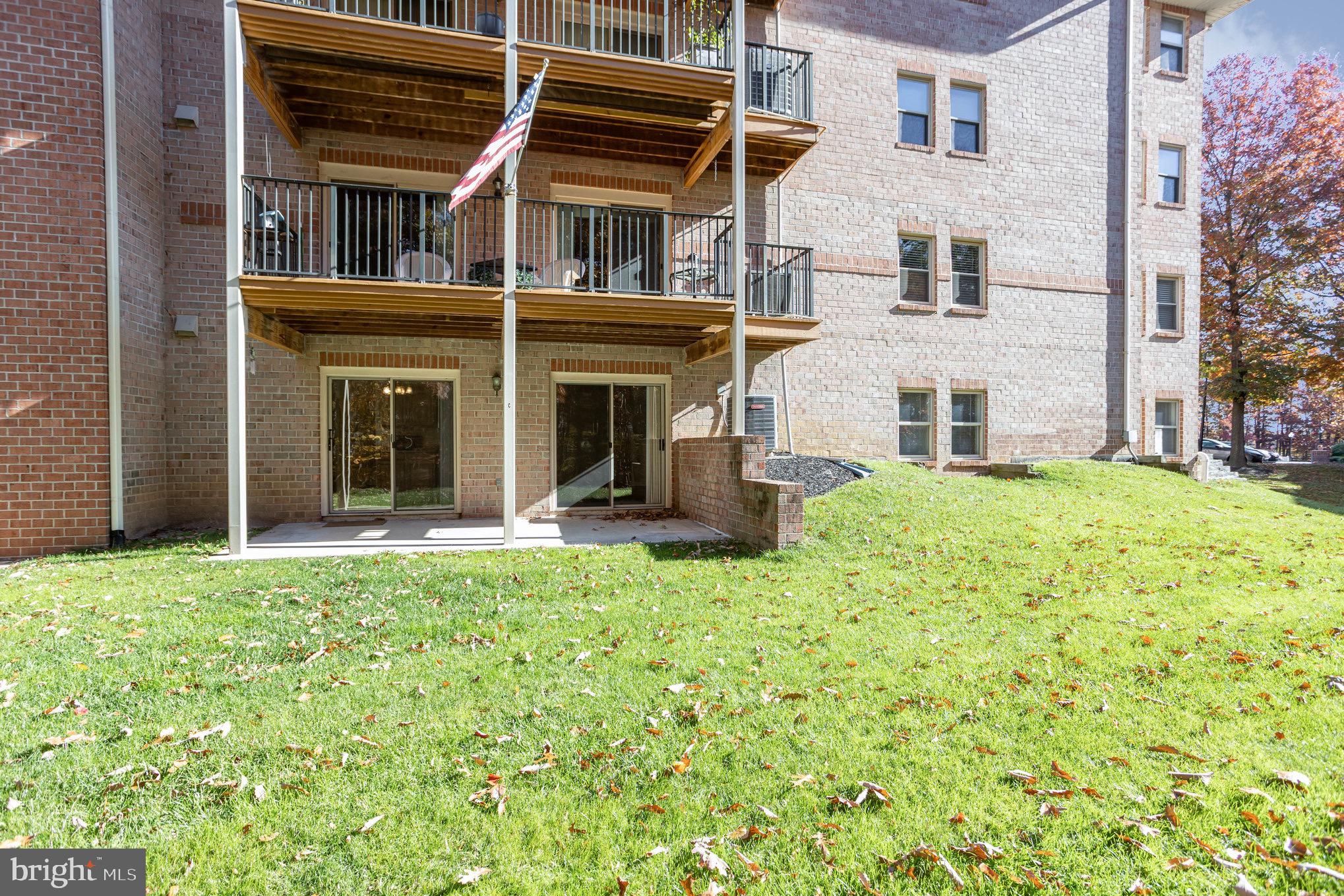 3901 Darleigh Road, Unit C Nottingham, MD 21236 - Photo 21 of 23 front view of a building with a yard