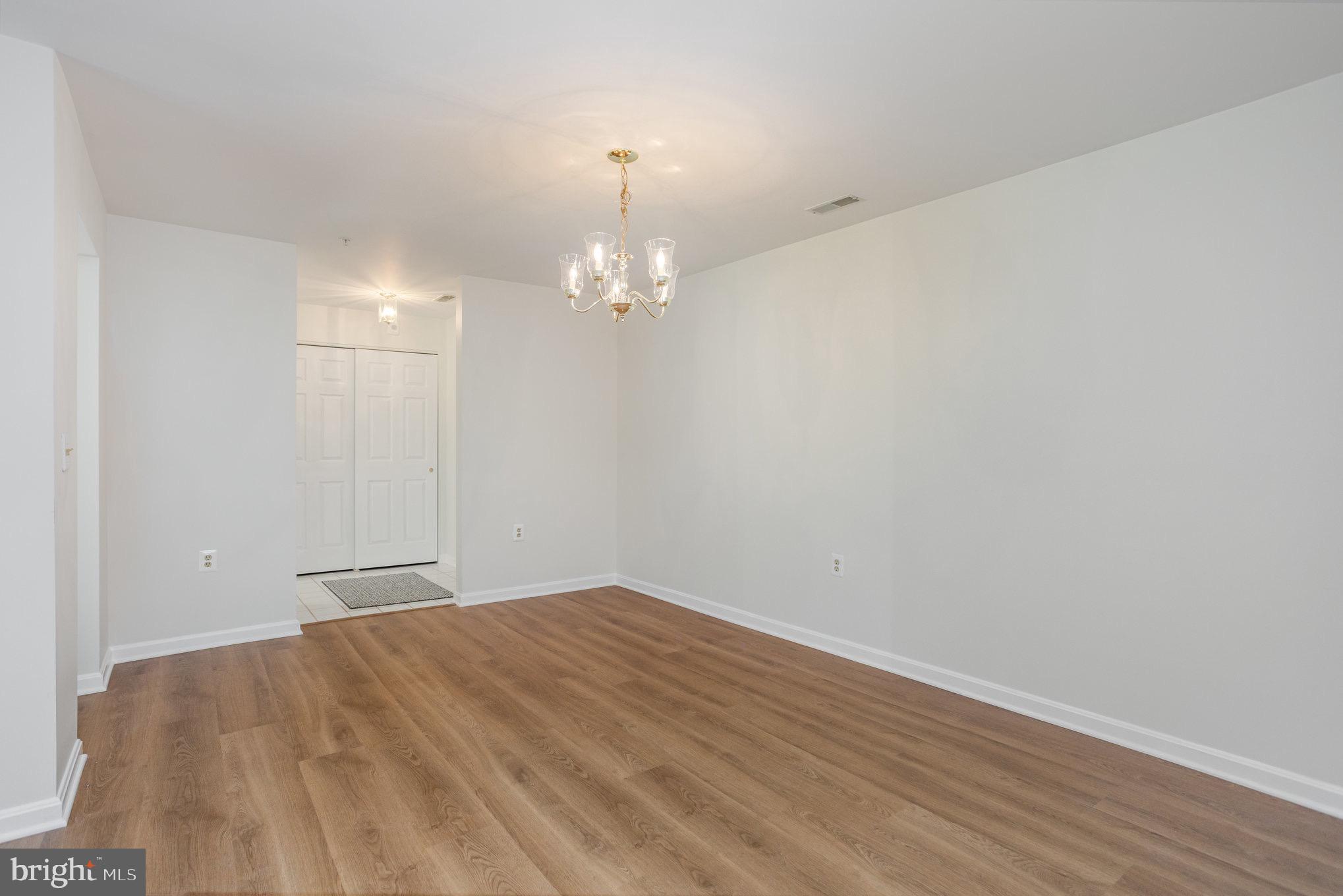 3901 Darleigh Road, Unit C Nottingham, MD 21236 - Photo 5 of 23 a view of an empty room with wooden floor