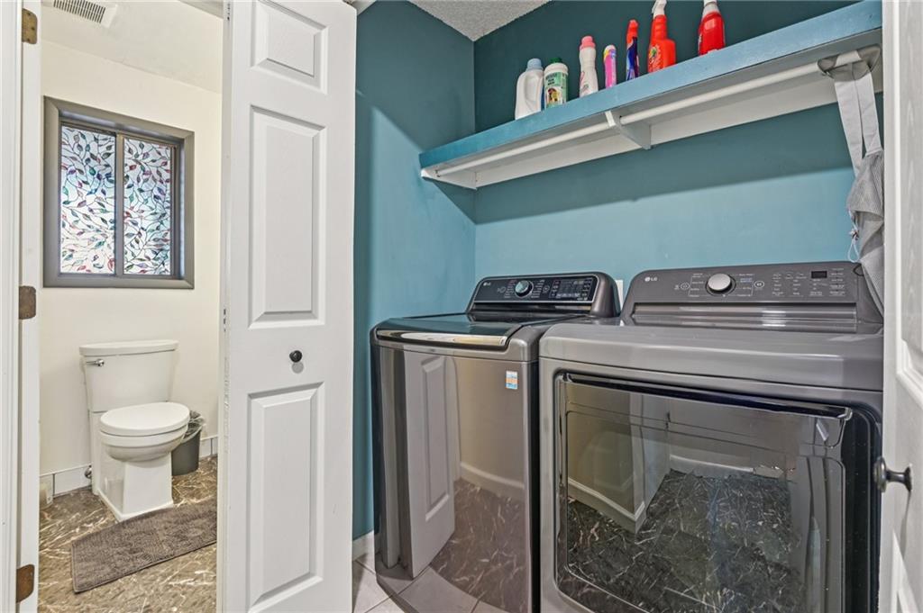 9485 Martin Road Roswell, GA 30076 - Photo 12 of 33 a utility room with dryer and washer