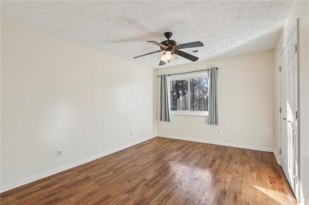 9485 Martin Road Roswell, GA 30076 - Photo 16 of 33 a view of a big room with wooden floor and windows