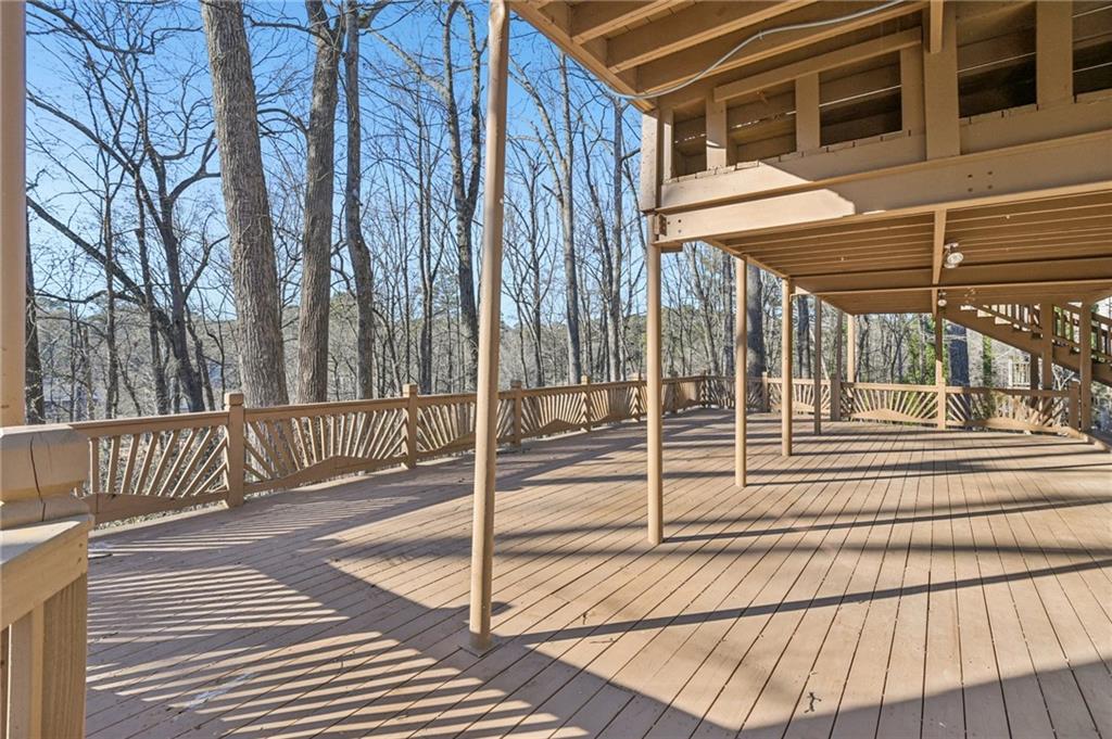 9485 Martin Road Roswell, GA 30076 - Photo 26 of 33 a view of a house with a wooden fence