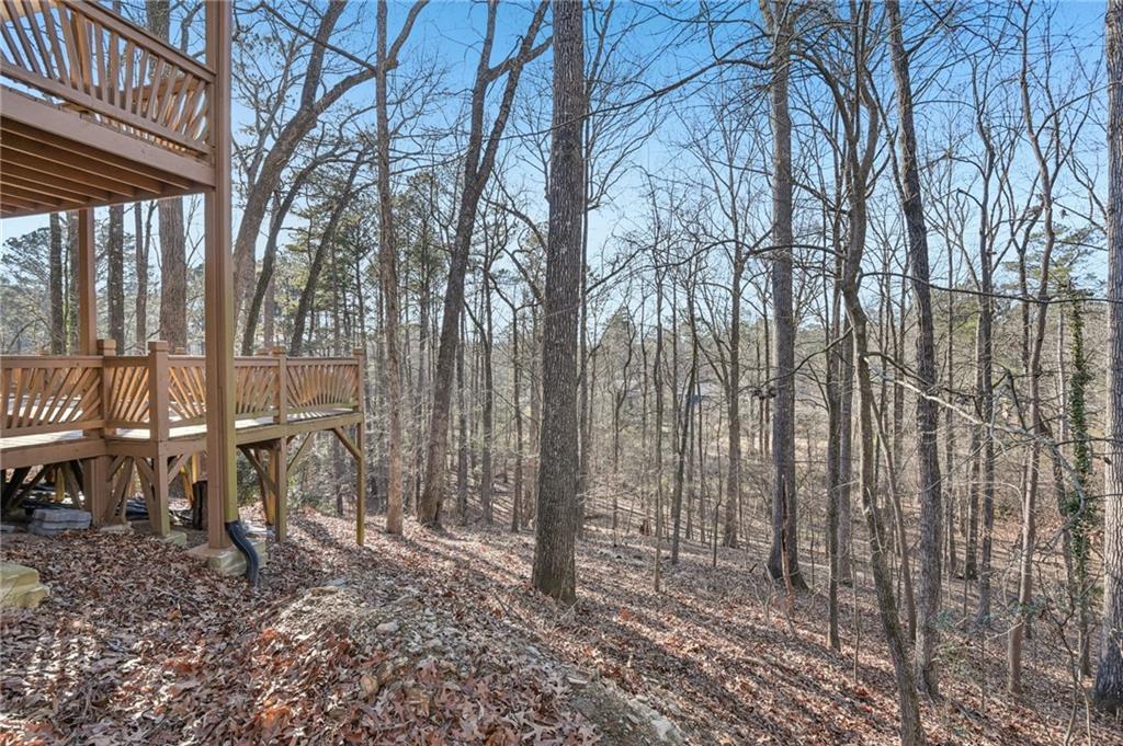 9485 Martin Road Roswell, GA 30076 - Photo 27 of 33 a backyard of a house with table and chairs