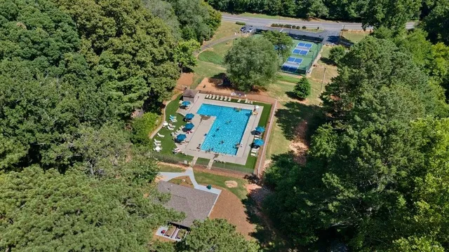 an aerial view of a house with outdoor space and street view