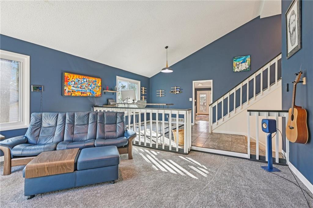 9485 Martin Road Roswell, GA 30076 - Photo 3 of 33 a view of staircase with furniture and stairs