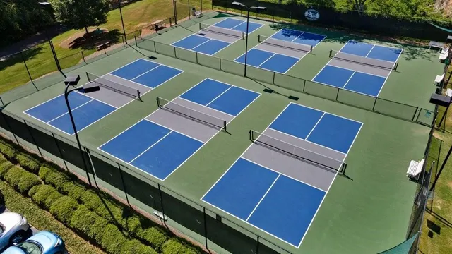 a view of a tennis ground with windows