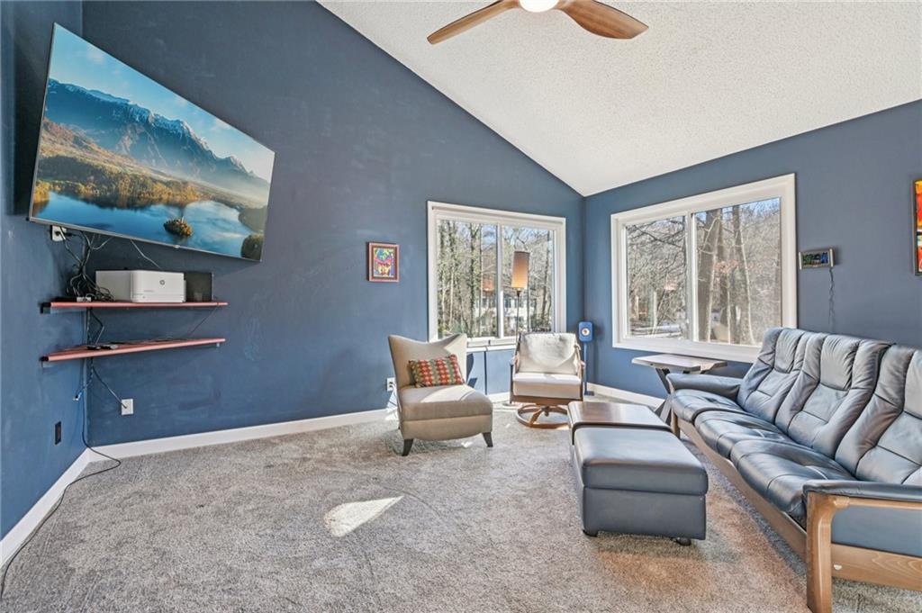 9485 Martin Road Roswell, GA 30076 - Photo 4 of 33 a living room with furniture and a flat screen tv