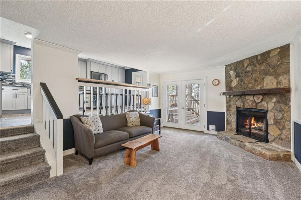 9485 Martin Road Roswell, GA 30076 - Photo 9 of 33 a living room with furniture and a fireplace