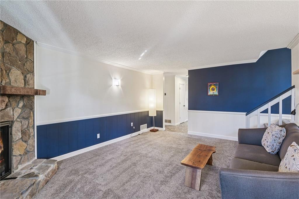 9485 Martin Road Roswell, GA 30076 - Photo 10 of 33 a living room with furniture and a fireplace