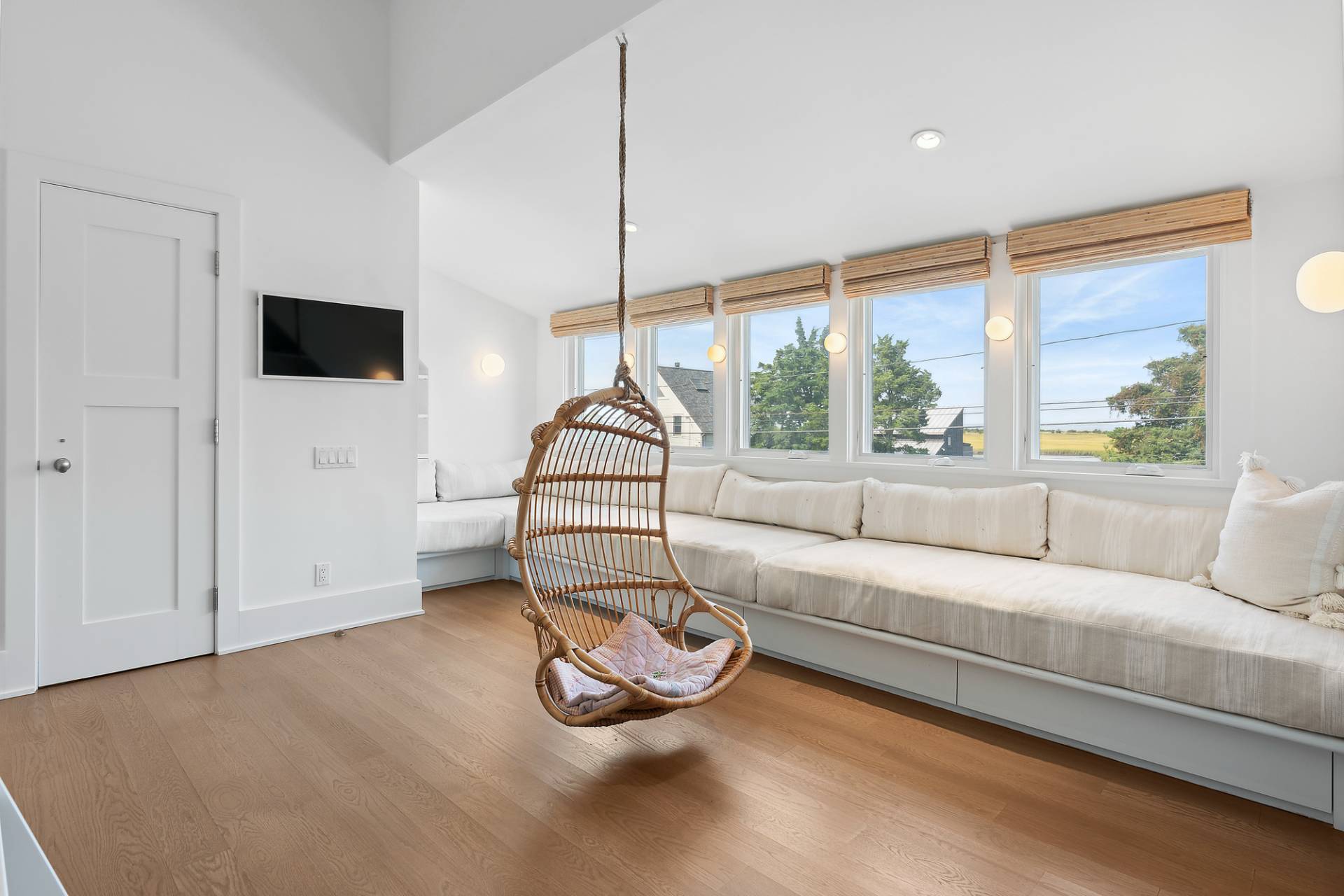 210 Towd Point Road Southampton, NY 11968 - Photo 11 of 21 a living room with furniture a flat screen tv and a large window