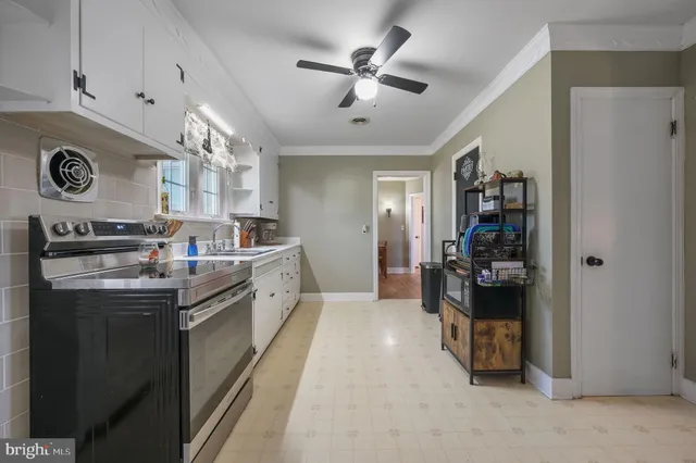 a kitchen with stainless steel appliances granite countertop a sink and cabinets