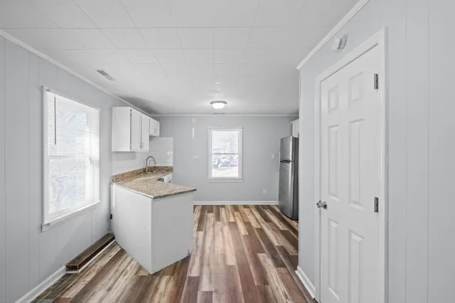 a view of a kitchen from the hallway