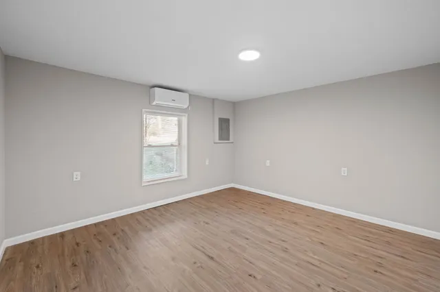 a backyard of a house with lots of green space and trees