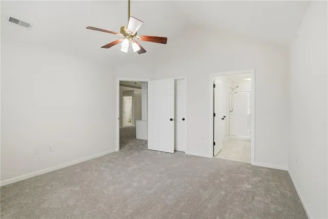 a bathroom with a sink vanity granite toilet and shower