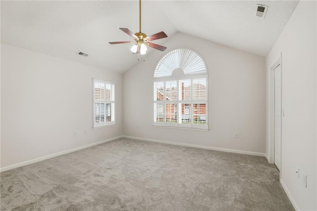 34102 Harvest Ridge Lane, Unit 34 Alpharetta, GA 30022 - Photo 23 of 31 a view of an empty room with a window