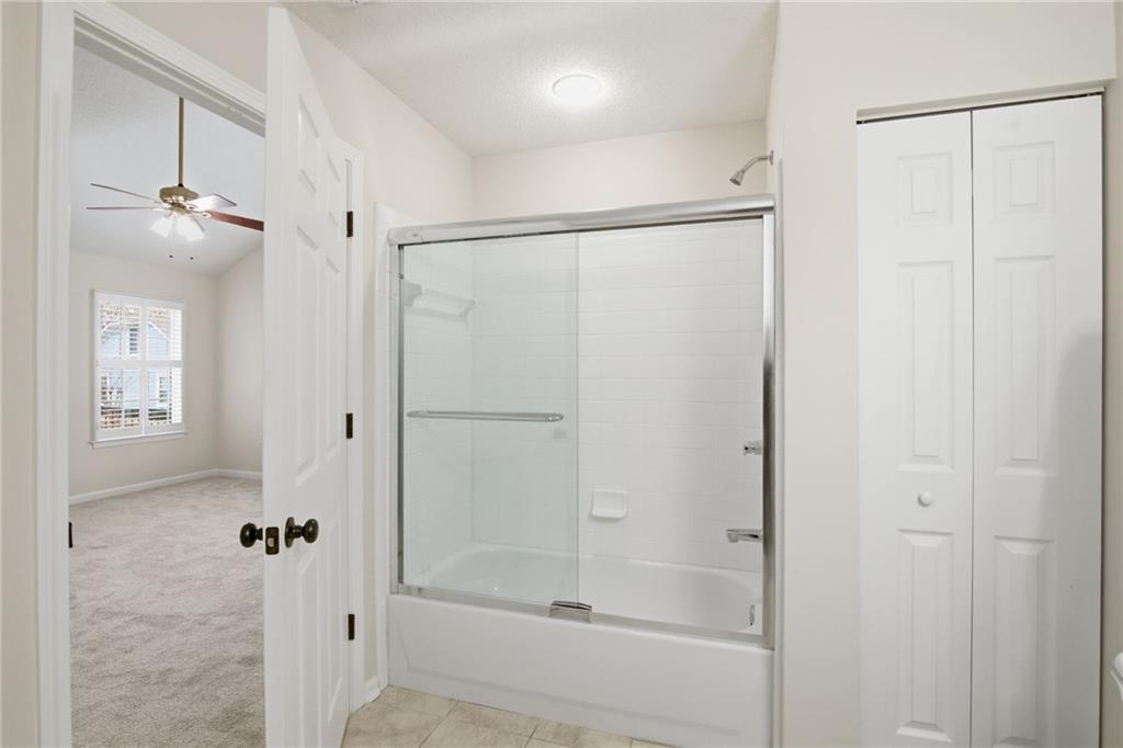 34102 Harvest Ridge Lane, Unit 34 Alpharetta, GA 30022 - Photo 27 of 31 a bathroom with a shower