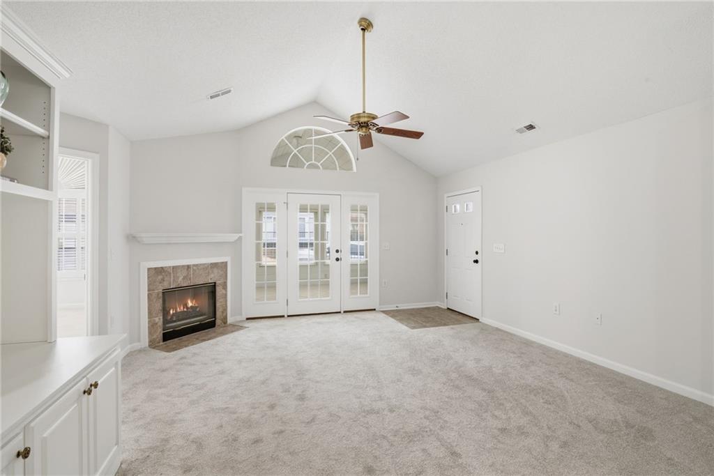 34102 Harvest Ridge Lane, Unit 34 Alpharetta, GA 30022 - Photo 4 of 31 a view of empty room with fireplace